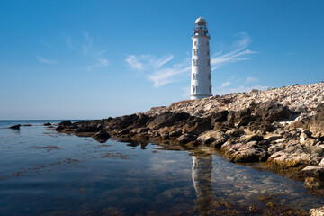 Obraz premium lighthouse on the shore of the sea