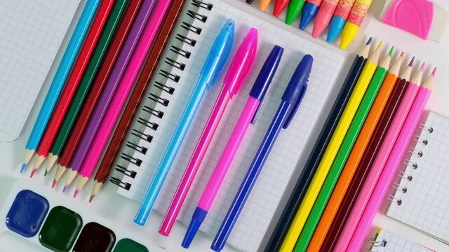 4K. Spinning of Colorful School Stationery. Back to school Education concept. School pupil Stationery. School office supplies on white background. 360 degree rotation. Top view, Flat Lay