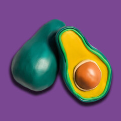 Plasticine illustration, set of fruits, Fresh avocado solated on a violet background. Side view. closeup, whole and sliced avocado with bone