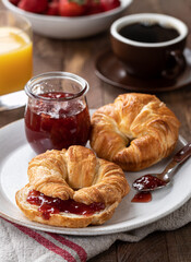 Croissants With Strawberry Jam on a Plate