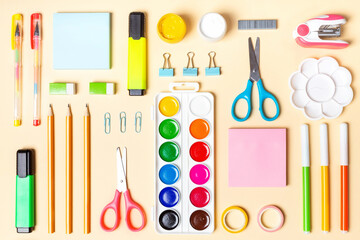School or office supplies on yellow background. Concept back to school
