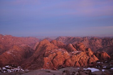 Sunrise in the mountains of Sinai , Egypt .  Snow at the mountains . 