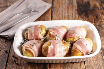 baked potato with bacon and rosemary