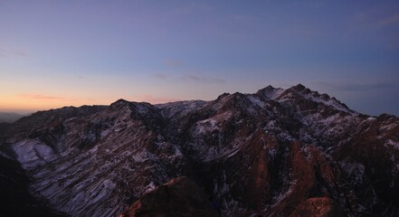 Sunrise on the mount of Sinai , Egypt .  Panoramic view on Saint Catherine mountain . Snow at the mountains . 