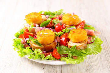vegetable salad with toast and goat cheese