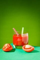 Tomato juice and sliced tomatoes on a table