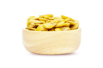 Nuts or Salted broad beans or vicia faba, on wooden cup. Crispy it's a snack. Isolated on white...