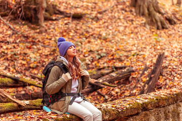 Woman relaxing outdoors on sunny autumn day