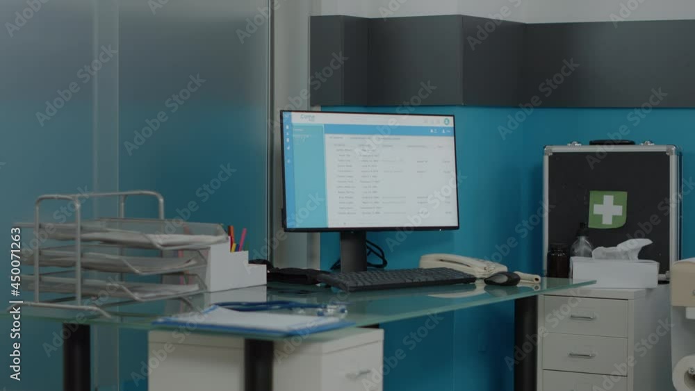 Poster close up of empty desk for nurses with computer monitor and document files at medical clinic. nobody
