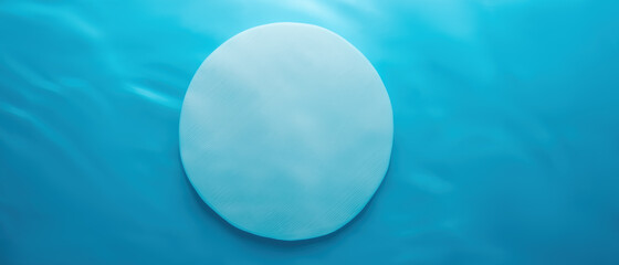 Empty white circle podium on blue water texture with waves in sunlight. layout, copyspace.Abstract...