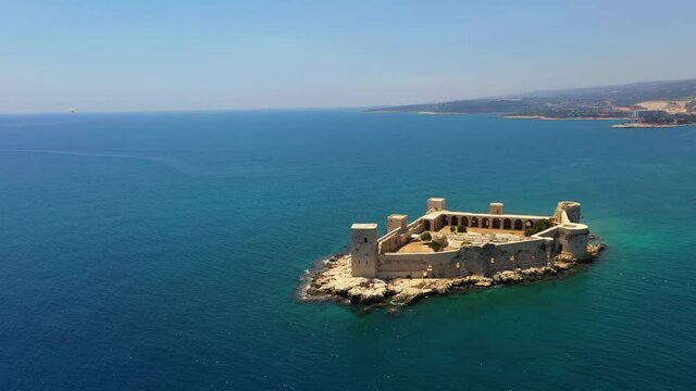 Kızkalesi is a town in Mersin Province, Turkey. The town, known in Antiquity as Corycus or Korykos, is named after the ancient castle built on a small island just facing the town.