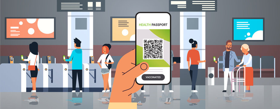 hand holding smartphone with digital immunity passport with qr code on screen risk free covid-19 pandemic
