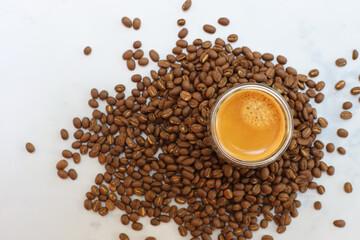 Americano Espresso coffee beans on cup topview on white background