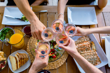 Party with glasses of wine.Glasses with wine over the table top view.Birthday party.Friends are drinking.Meeting of friends.Nice company.Celebration with glasses.Family dinner with wine. cheers.Meet