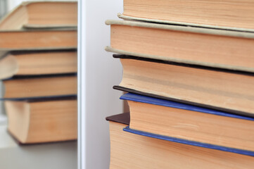old thick textbook on the school desk , knowledge concept  study hard