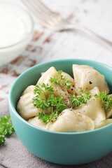 Russian national dish pelmeni served in a plate