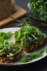 Sandwiches with salmon, avocado and salad
