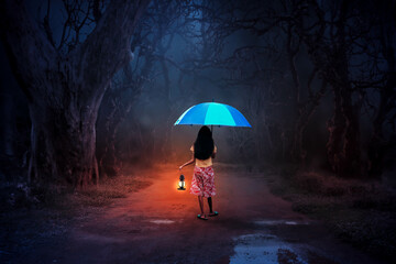 It's raining, a little girl with a lantern wanders into the forest alone in the night.