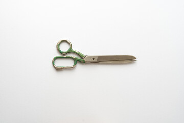 Flat lay composition with sewing scissors on white background.