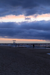 cloudy sunset over the sea and lifeguard stand