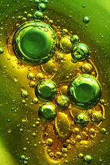 oil bubbles with water on glass