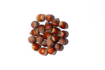 Hazelnuts on a white background. Close-up. Selective focus.