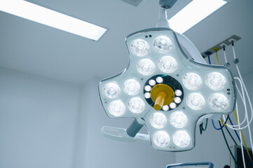 A surgical light in an operating room in hospital. A surgical light is used exclusively during surgical procedures.