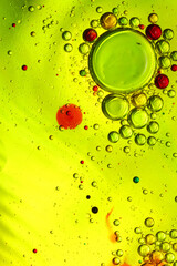 oil bubbles with water on glass