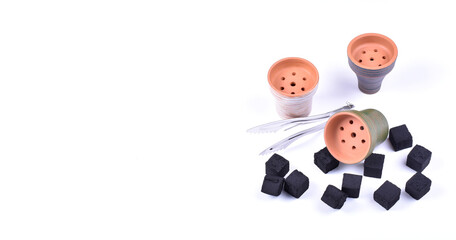 Hookah bowls with tobacco and charcoal for smoking on a white background. Space for text. Banner