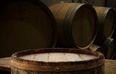 Old wooden barrel on a brown background