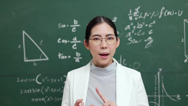 Young asian teacher woman teaching speak to camera video conference with student. Female teacher training the mathematics in classroom blackboard online course.