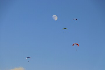 paragliding in the blue sky