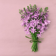A lush bouquet of delicate purple bells with copy space for design.
