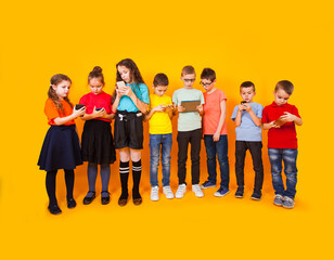 Obraz premium Young kids playing game on mobile phone