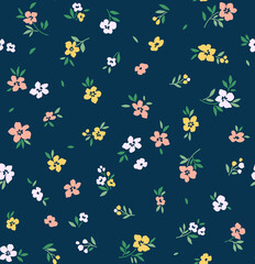 Cute floral pattern. Seamless vector pattern. Elegant template for fashion prints. Small white, pink and yellow flowers. Dark blue  background. Summer and spring motifs. Stock vector.