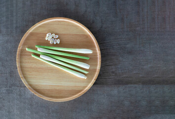 Fresh lemongrass and chilli on a wooden tray