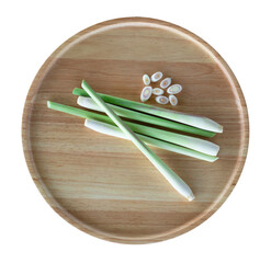 fresh lemongrass in a wooden tray on white background