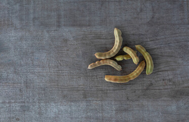 young tamarind on the wooden floor