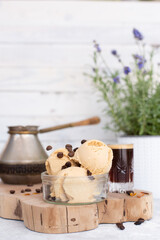 home made coffee ice cream with coffee shot and flying levitating coffee beans