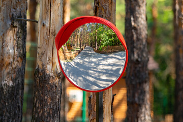 Obraz na płótnie Canvas Round mirror sign in the forest