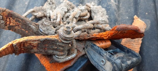Rusty chain and mud