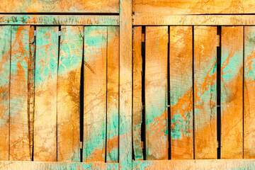 Old with cracks and stains, wooden rustic background, stains of yellow and blue paint.