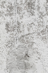 Old with cracks and spots, cement plaster walls, light background.