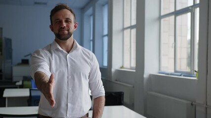 Man stands and smiles on the camera