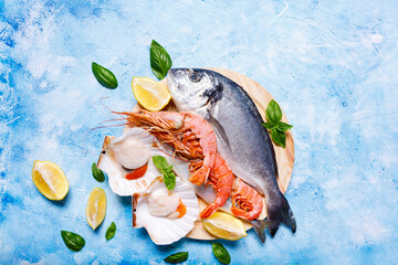 Food background with sea fish on blue.