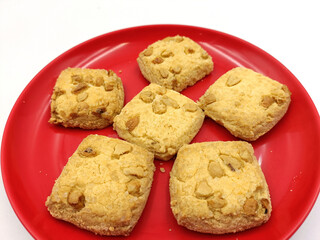 Home made sweet biscuits with mixed nuts on white background