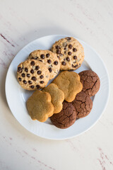 Set of oatmeal cookies on a white plate on a table