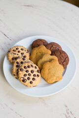 Set of oatmeal cookies on a white plate on a table