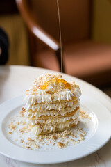 Waffles with nuts and cream with honey
