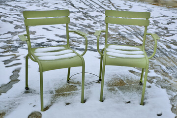 Germany, Karlsruhe: two chairs covered with snow in winter